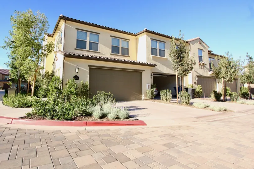 Two story units with gray garages inside Mandolin in Rancho Bernardo California