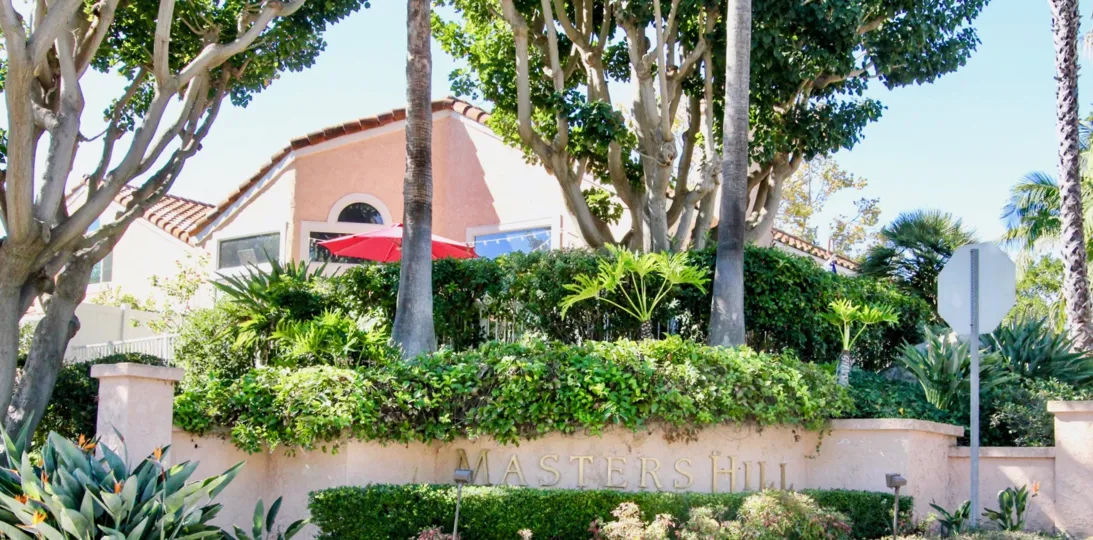 A sunny day in the Masters Hill community, with green bushes and trees