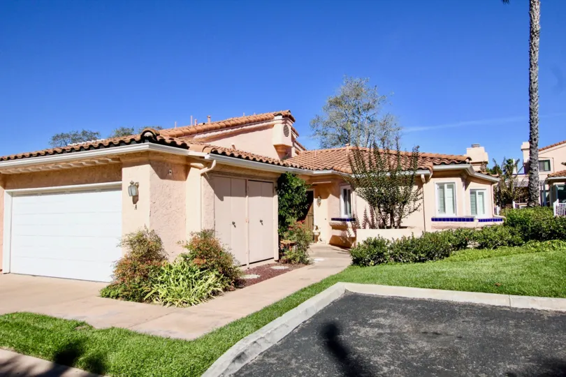 Pink units with grass and trees inside Masters Hill in Rancho Bernardo CA