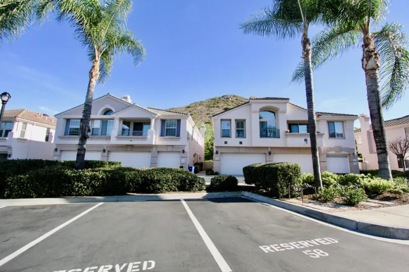 Two story town homes & parking lot inside Mira Lago in Rancho Bernardo CA