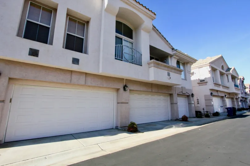 Garages lining a driveway near residence at Mira Lago in Rancho Bernardo California