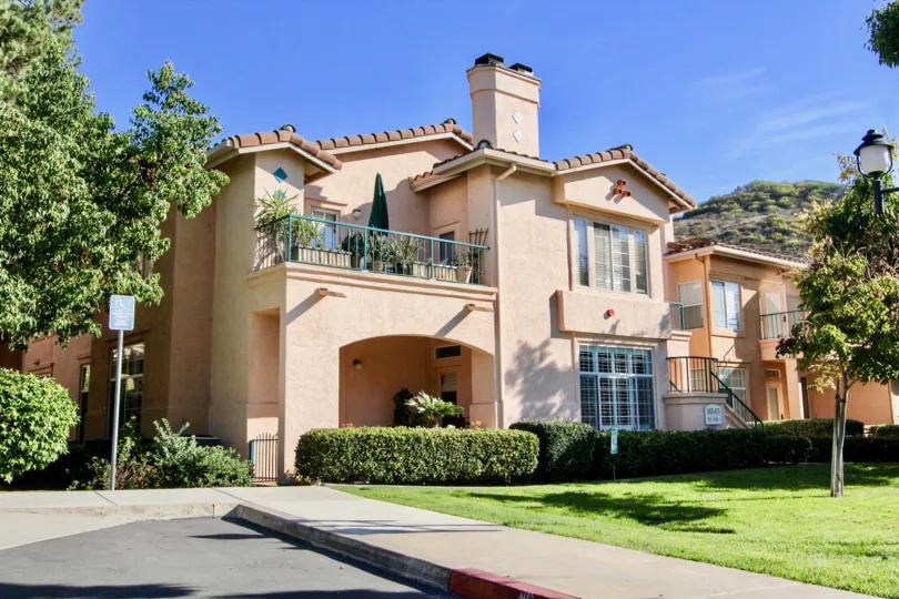 Two story pink condo housing inside Morada in Rancho Bernardo CA