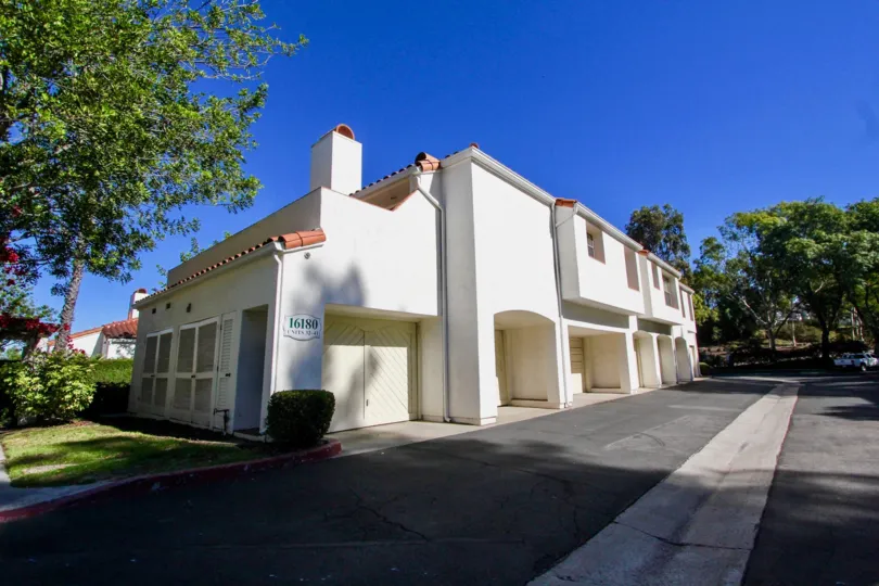 Two story white units with archways inside Palazzo Bernardo in Rancho Bernardo CA