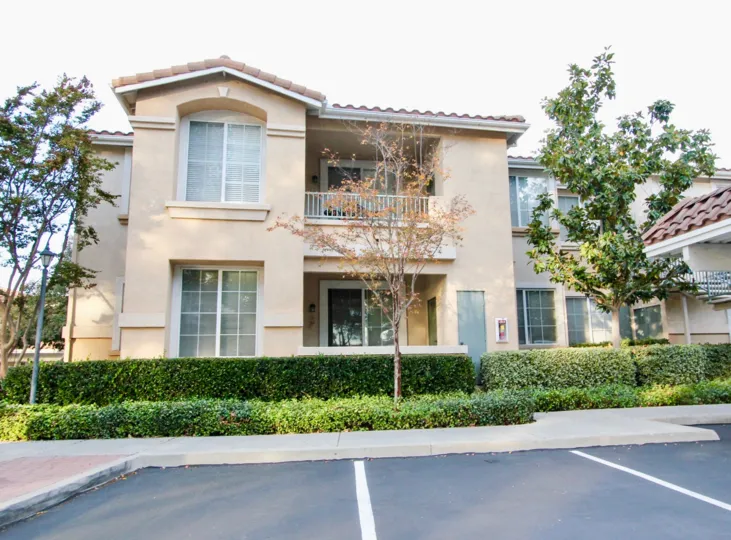In sunny day, A house in Palo alto with trees and grass in CA