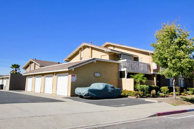 Playmor, City: Rancho Bernardo, backside of a building, a car parked and covered