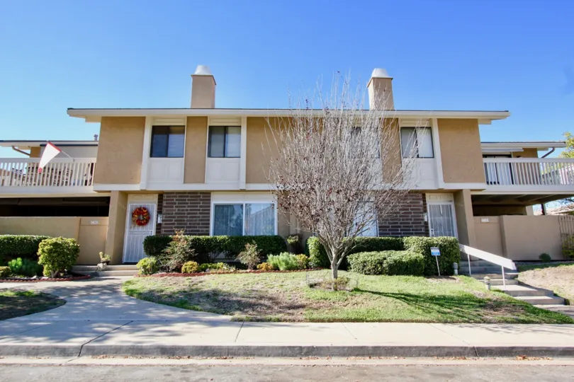 Rental properties in Playmor with a tree in the front yard