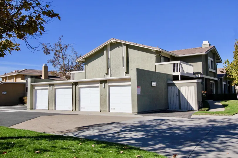Several garages on a sunny day in Playmor community