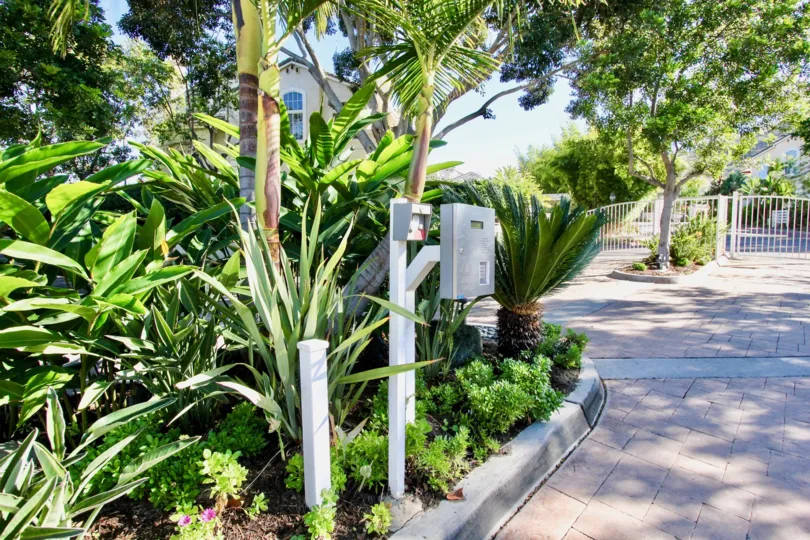 Silver intercom near green plants at Provencal in Rancho Bernardo California