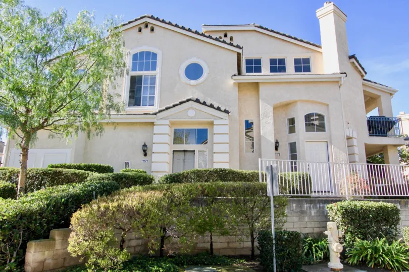Two story white building with windows & railings at Provencal in Rancho Bernardo California