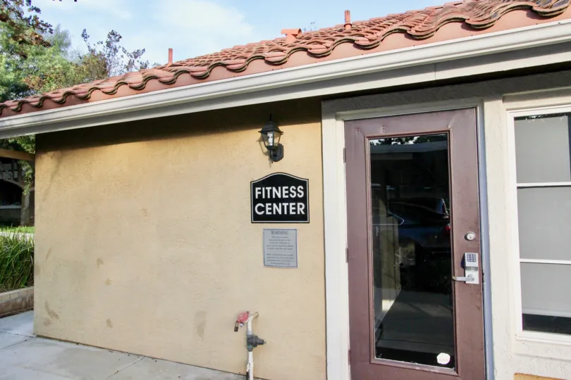 Fitness center with glass and wooden door at Sabre Terrace in Rancho Bernardo CA