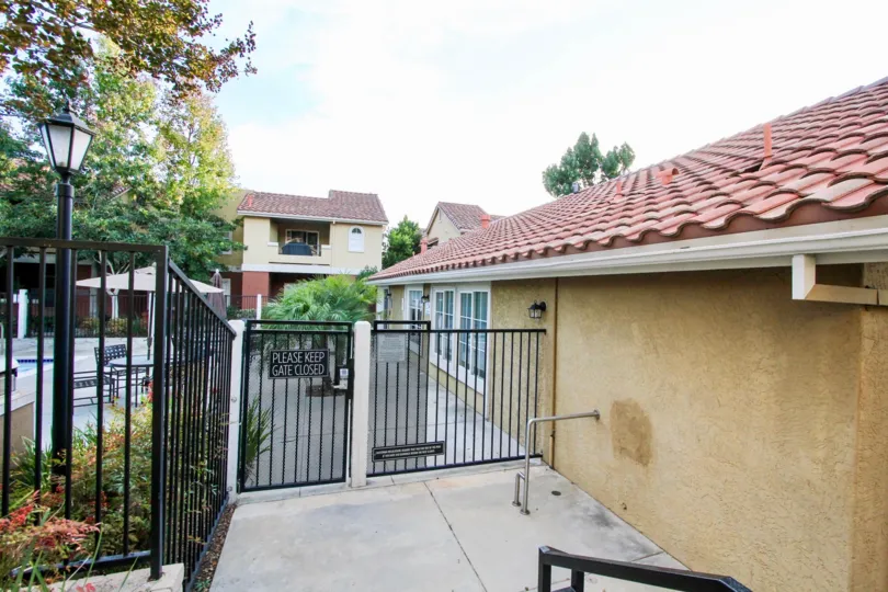 Sabre Terrace can be found in Rancho Bernardo California, this photo displays their Spanish architecture and pool area