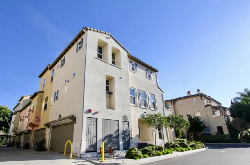 A street in San Moritz has apartments with plants and trees