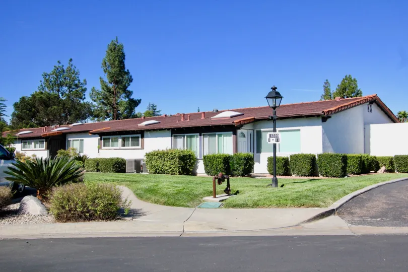 Single story home with a red roof at Seven Oaks Haciendas in Rancho Bernardo CA
