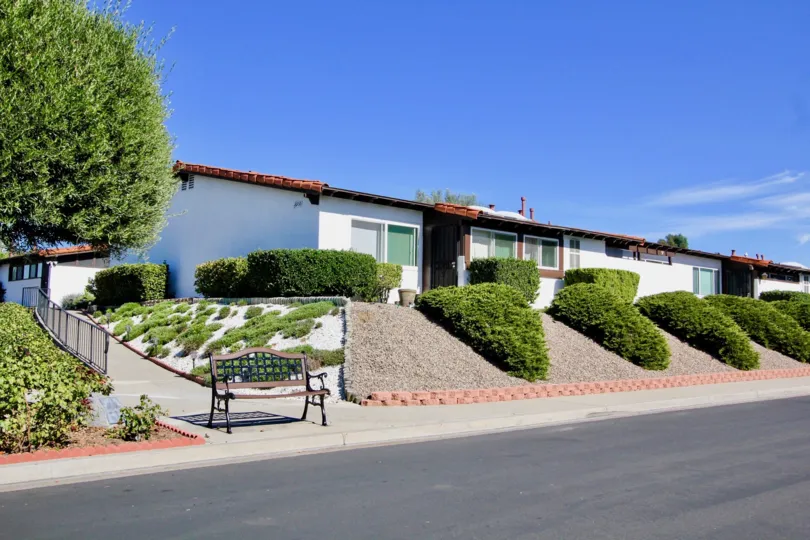The road side in Seven Oaks Haciendas has slope grass and chairs