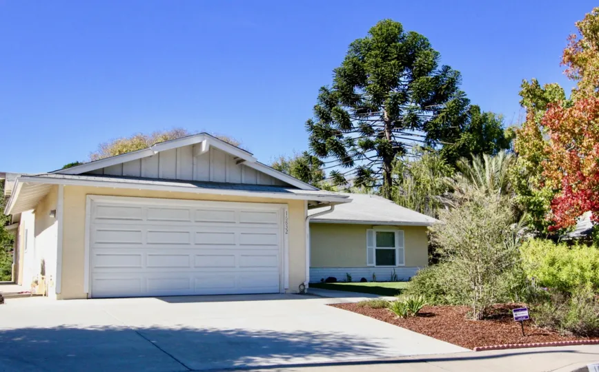 Backside of the villa in Seven Oaks has long trees and plants