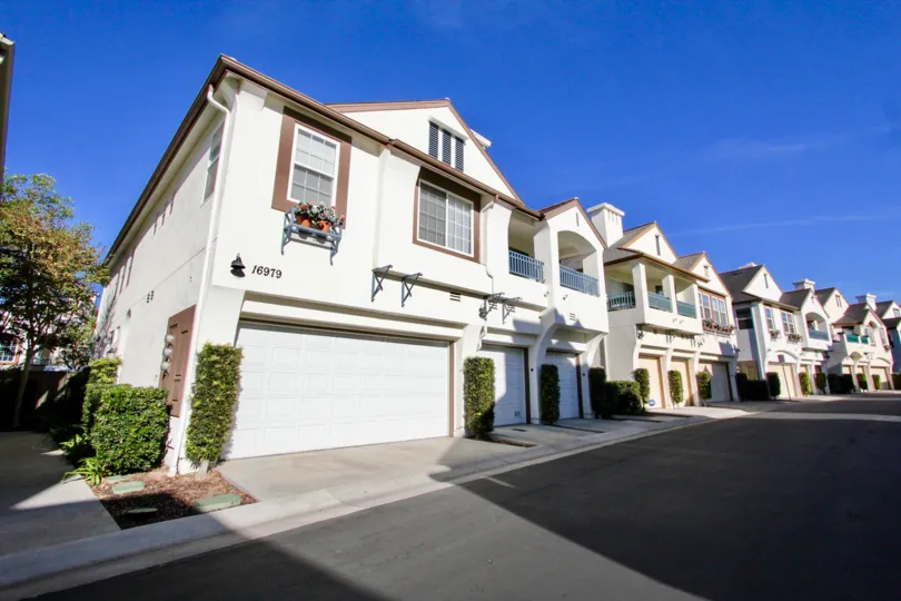 Sitella's two story residential units with attached white garages in Rancho Benardo California