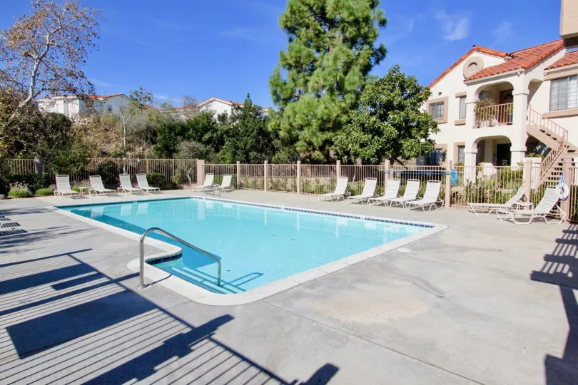 In Stony Brook, villa has swimming pool and chairs for relax