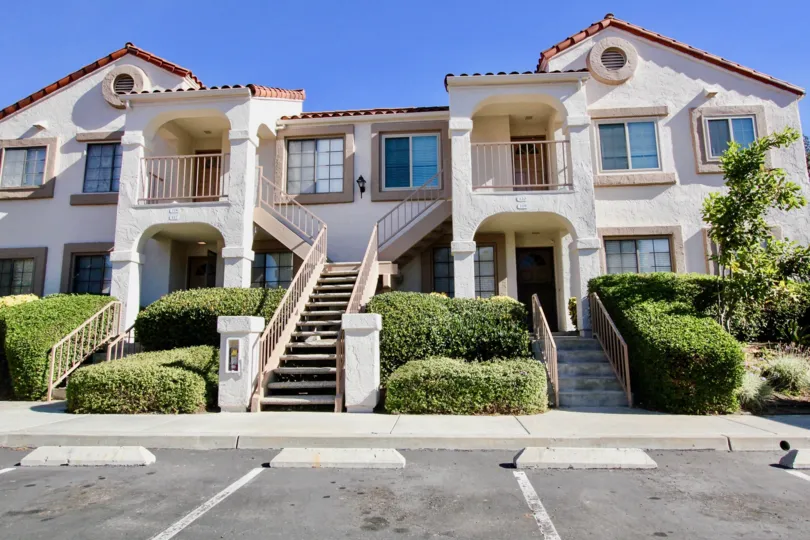 Stony Brook's front view with stairs and shrubs in Rancho Bernardo California.