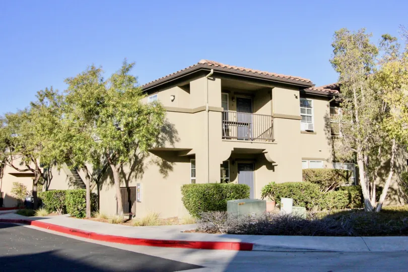 A sunny day in Sycamore Walk has villa with trees, grass
