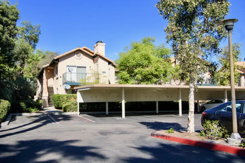 Covered parking next to a residential building at The Falls in Rancho Bernardo CA