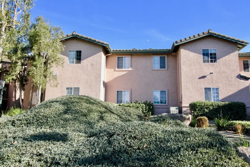Two story pink housing inside The Summit in Rancho Bernardo CA