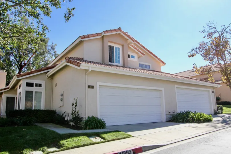 Two story home with two large garages inside Tierra Del Sol at Rancho Bernardo CA