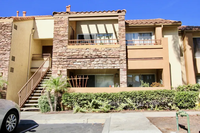 Two story residential units with stone facing inside Villa Taviana in Rancho Bernardo CA