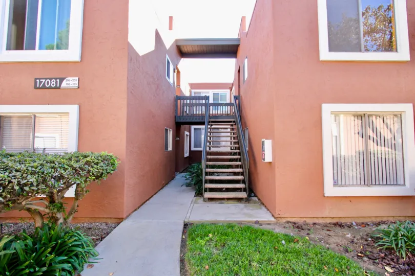 Stairway between pink units inside Waterbridge In Rancho Bernardo CA