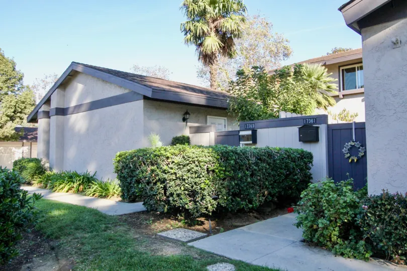 In Westwood Townhomes, Villa has a number 17361 along with bushes