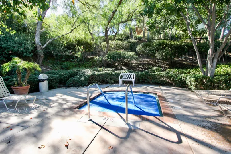 In Windham park, Children's pool and chair are there with flower pot and trees