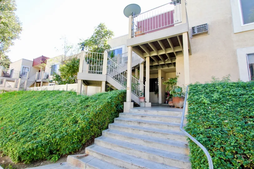 Autumn Heights stairway and beige building with landscaping San Marcos California
