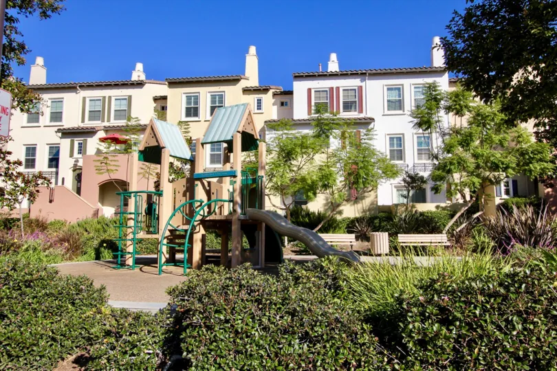 A clear day in the Calico Bluffs community with a children's playground.