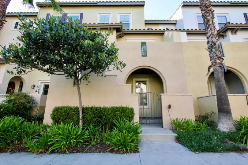 A sunny day in the area of Calico Bluffs, outside, condo, trees, roof, gated entrance
