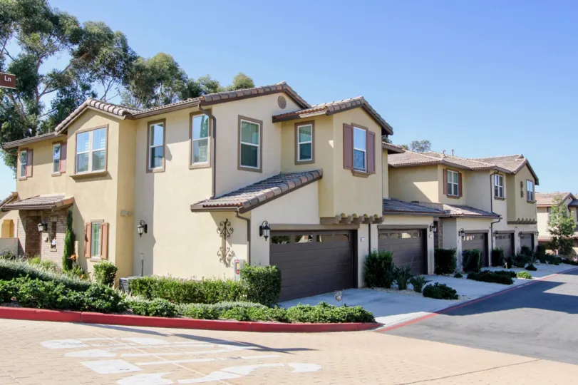 A bright day and a row of homes in the Candera community of San Marcos California
