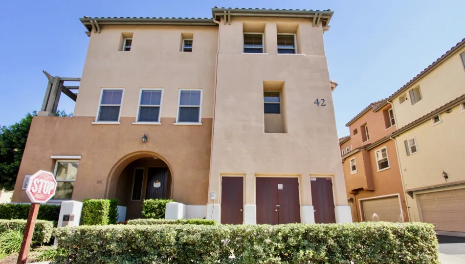 Awesome villa with garden on a sunny day with signboard in Coronado Ranch of San Marcos