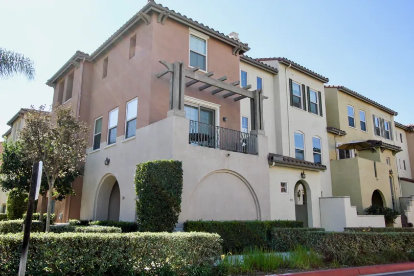 A sunny day in the Coronado Ranch neighborhood with several homes nearby