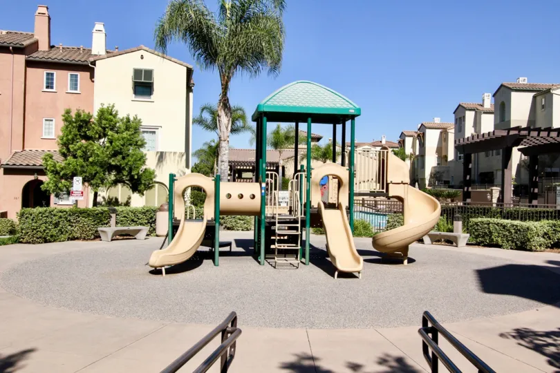 Playground with slides in park like setting at Corte Bella in San Marcos, Ca.