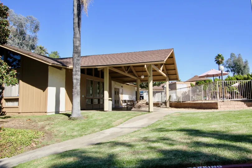 Side open space view with chairs and table of Fairway Knolls community, San Marcos, CA