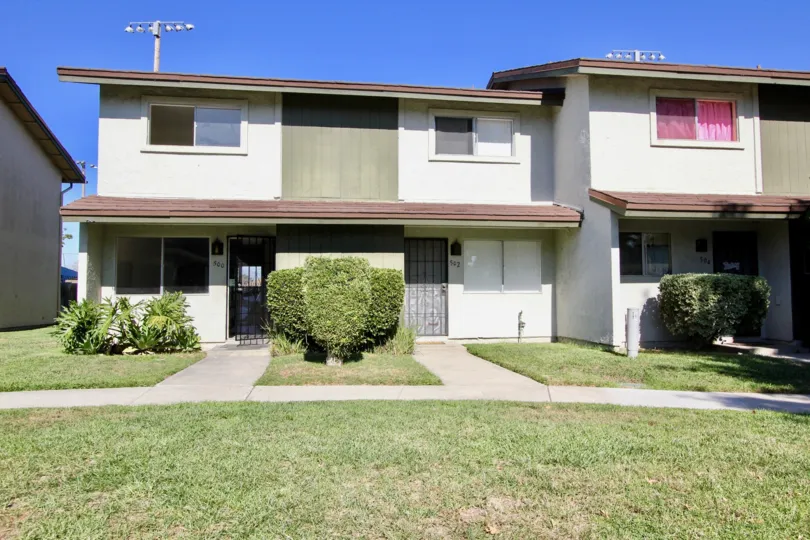 Very eco friendly home with plants and lawn of Lake Park Villas.