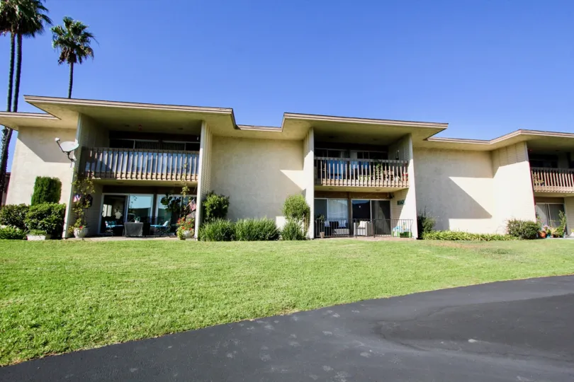 Beautiful sunny day at Lake San Marcos Condos with a couple of palm trees in the background