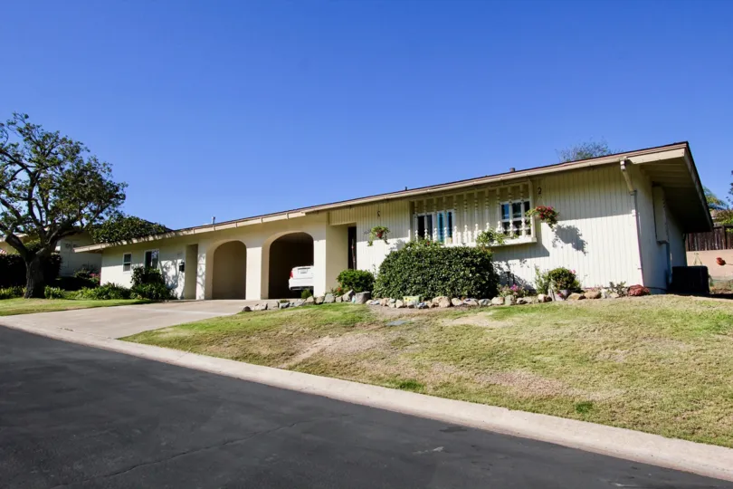 A sunny day in the area of Lake San Marcos Villas, outside, condo, tree, bush, grass, driveway, car