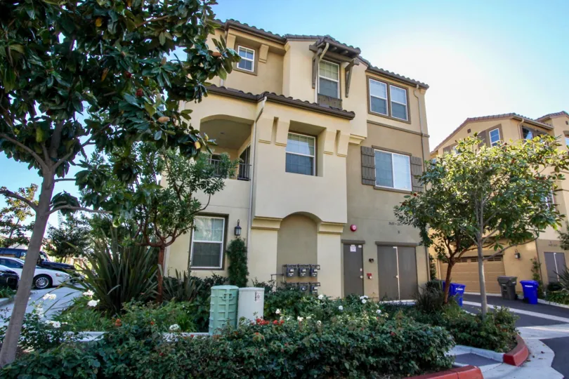 A multiple unit residence that is in a tan and brown coloring in Laurel community.