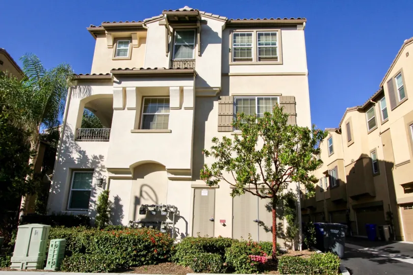 Three story home with a little tree inside Laurel in San Marcos CA