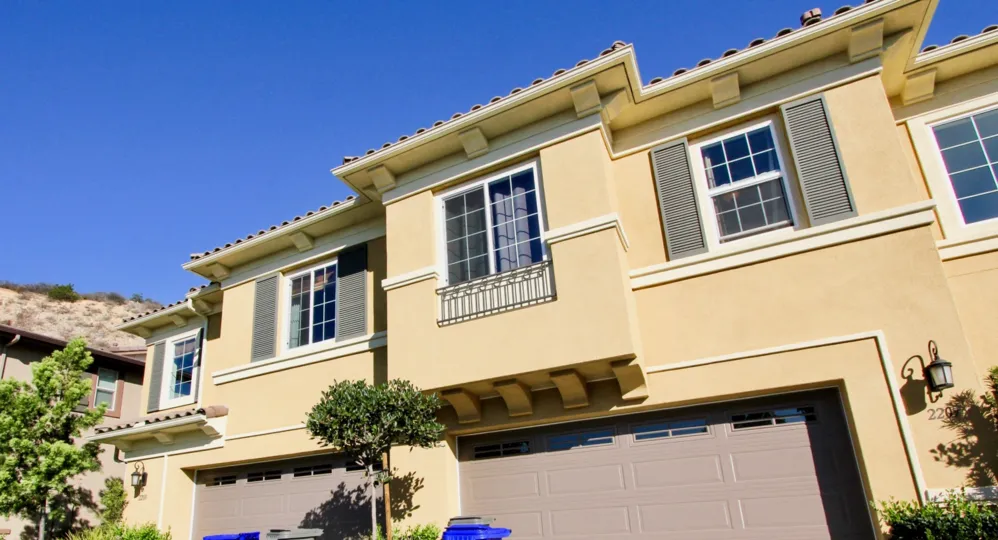 A sunny day in the area of Laurel, outside, garage, trees, windows, condo