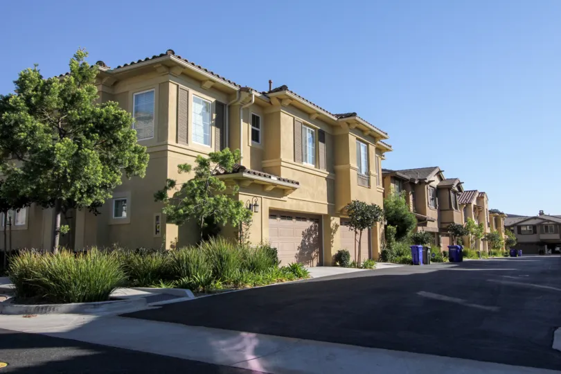 A large Laurel housing structure next to a driveway at San Marcos CA