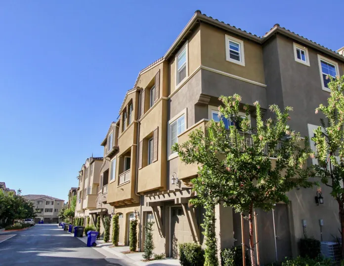 Two trees on the side of a condominium compound at Laurel in San Marcos CA