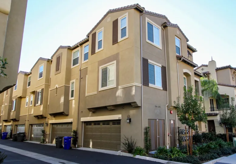 Gray garage doors on attached garages in Magnolia at San Marcos CA