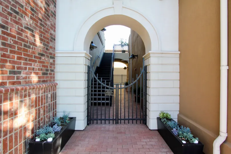 Flower pots are placed at the two sides of the gate in the Market Walk villa
