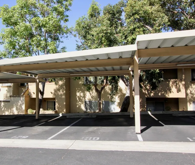 The sun shines on cover parking spaces in Mission Park San Marcos California