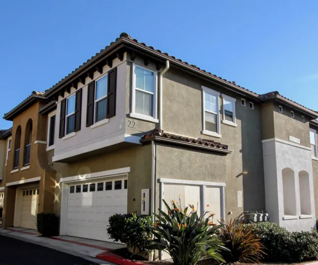 Two story gray homes with black roof in the Morgans Corner in San Marcos CA